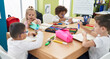 © Krakenimages.com - Group of kids students sitting on table studying at classroom