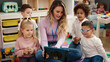 © Krakenimages.com - Woman and group of kids having lesson using touchpad at kindergarten