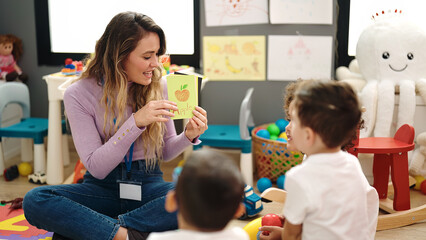 Sticker - Woman and boys having vocabulary lesson with word cards at kindergarten