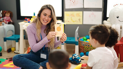 Poster - Woman and group of kids having vocabulary lesson with word cards at kindergarten