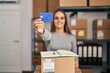 © Krakenimages.com - Young blonde woman ecommerce business worker holding credit card at office