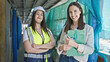 © Krakenimages.com - Two women architect and worker holding clipboard working at street