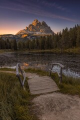 Wall Mural - Bridge with mountain in the background at sunset in the Dolomites