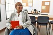 © Krakenimages.com - Senior african american woman business worker using touchpad at office