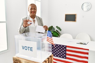 Sticker - Senior african american woman holding i voted badge voting at electoral college