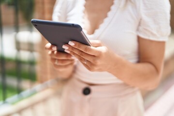 Sticker - Young caucasian woman using touchpad at street