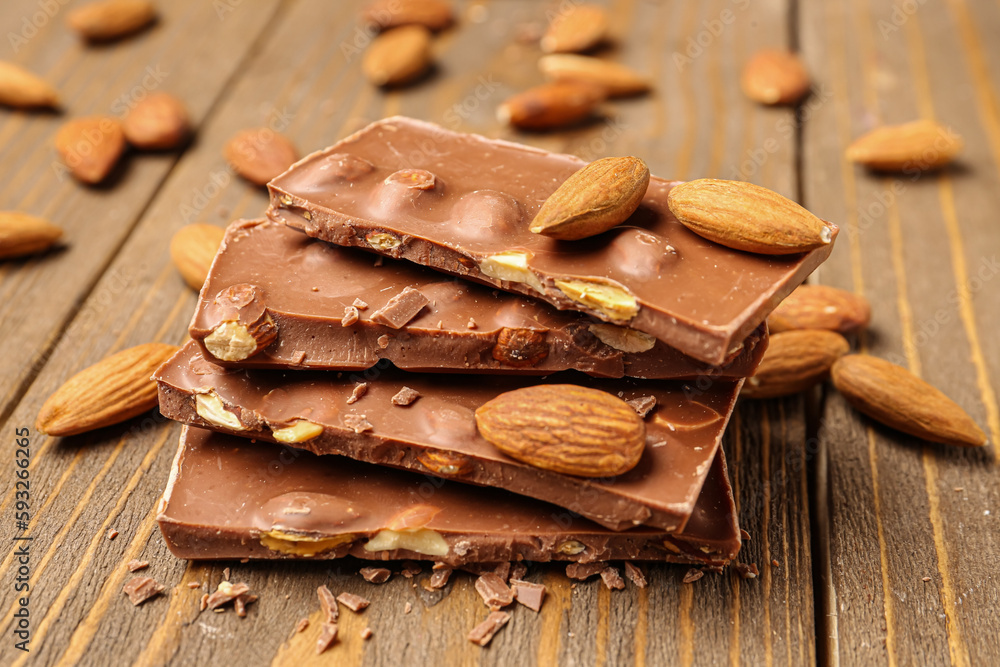 Sweet tasty chocolate with nuts on  wooden background