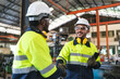 © chokniti - professional business industry technician wearing safety helmet working to maintenance service and checking factory equipment, a work of engineer occupation in manufacturing construction technology