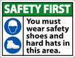 Safety First Sign, You Must Wear Safety Shoes And Hard Hats In This Area