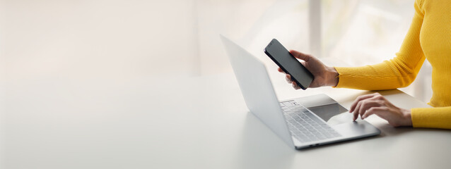 A person holds a mobile phone to use social media on a smartphone, communicating via the Internet on a smartphone. The concept of using technology in communication.