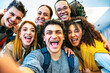 © Nicolas Micolani - Happy multiracial friends travelers taking selfie shot at hostel reception- Young group of people having fun together looking at camera-Life Style concept with trendy students