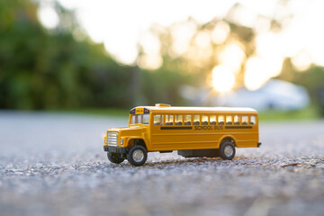 Canvas Print - Small model of american yellow school bus as symbol of education in the USA