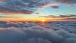Epic sunset over the clouds. Flight in the sky at sunset, view from window of airplane. Warm sun sets over the horizon in clouds