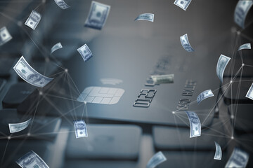 Close up of laptop computer keyboard and bank card with blurry flying dollar bills. Finance, success and casino concept.