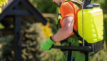 Wall Mural - Professional Gardener Equipped with Pump Sprayer