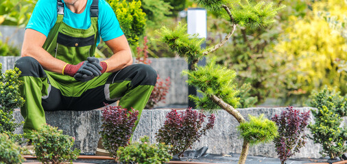 Wall Mural - Proud Landscaper Sitting in His Garden