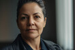 © aicandy - Close-up portrait of a confident social worker with a friendly demeanor and a meaningful gaze, generative ai