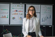 © aicandy - Hard-working and dedicated insurance agent posing in front of a whiteboard filled with colorful charts and graphs, demonstrating her expertise and attention to detail, generative ai