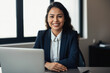 © aicandy - Portrait of a friendly and approachable loan officer with a big smile and a laptop on her desk, ready to provide financial advice, generative ai