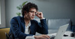 © andreybiling - Asian businessman at team meeting with his employees. Male entrepreneur having video tele conference from home office during self-isolation