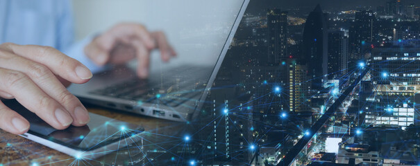 Digital Technology. Futuristic Tech Background: Man Using Mobile Phone and Laptop for Big Data Analysis and Internet Network Connection in a Smart City Environment