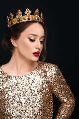 Wall Mural - Beautiful young woman wearing luxurious crown on black background