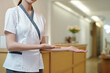 © DragonImages - Cropped image of spa salon receptionist welcoming clients inside