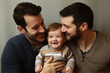 © Fabrizio - Same-Sex Male Couple: Embracing a Heartwarming Moment with Their Child. Generative AI