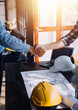 © ARMMY PICCA - Two business man construction site engineer. Engineering objects on workplace with partners interacting on background