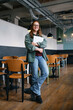 © Westend61 - Young freelancer leaning on table at cafe