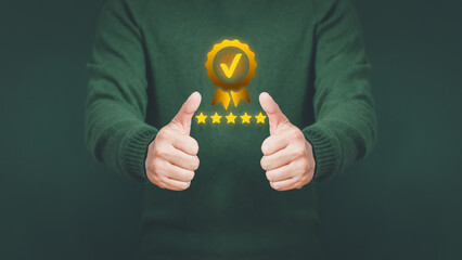 Fototapete - Businessman holding and showing the best quality assurance with golden five stars. Quality assurance of business services, Guarantee, Standards, ISO certification and testimonial concept.