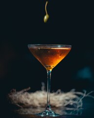 Poster - Vertical shot of a cocktail against a dark background.