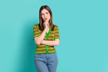 Sticker - Photo of minded smart lady wear stylish clothes arm touch face look empty space interesting offer isolated on cyan color background