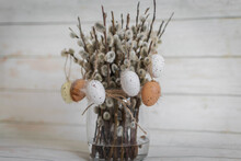 Fluffy Willow Branches Decorated With Easter Eggs In A Glass Vase, Easter Holiday