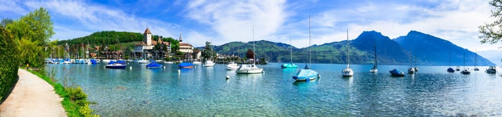 Wall Mural - Scenic lake Thun and the Spiez village with its famous medieval castle and old town in the alps in Canton Bern in Switzerland