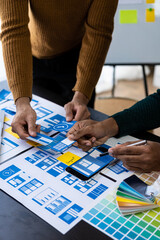 Wall Mural - brainstorm mobile app interface layout design ideas on graphic designer table.ux graphic designer cr