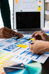 Wall Mural - brainstorm mobile app interface layout design ideas on graphic designer table.ux graphic designer cr