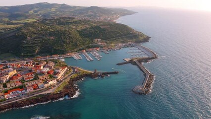 Wall Mural - 4k drone forward video (Ultra High Definition) of Castelsardo port. Splendid sunrise on Sardinia island, Province of Sassari, Italy, Europe. Fantastic spring seascape of Mediterranean sea.