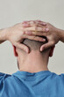 © Seventyfour - Minimal back view at man with bald head against white background
