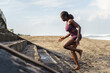 © Jovo Jovanovic/Stocksy - Woman doing a cardio workout running up the stairs at the beach shore