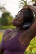 © Jovo Jovanovic/Stocksy - Woman stretching out while wearing headphones