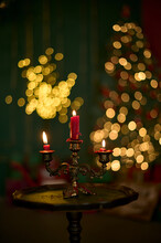 Three Candles In A Golden Candlestick On A Little Table