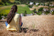 © ByLorena/Stocksy - Back woman hair looking at city