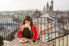 Attractive Girl Having Breakfast In A Beautiful European City
