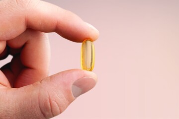 Poster - Hand holding the medical pill or supplements