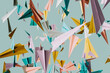 © Giada Canu/Stocksy - 3D render of paper planes in different colors