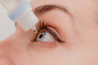 © VICTOR TORRES/Stocksy - Crop woman instilling eye drops