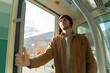 © Alba Vitta/Stocksy - Man commuting by train to work