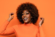 © VICTOR TORRES/Stocksy - Smiling black woman with afro hair