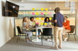 © BONNINSTUDIO/Stocksy - Business colleagues discussing strategy at office